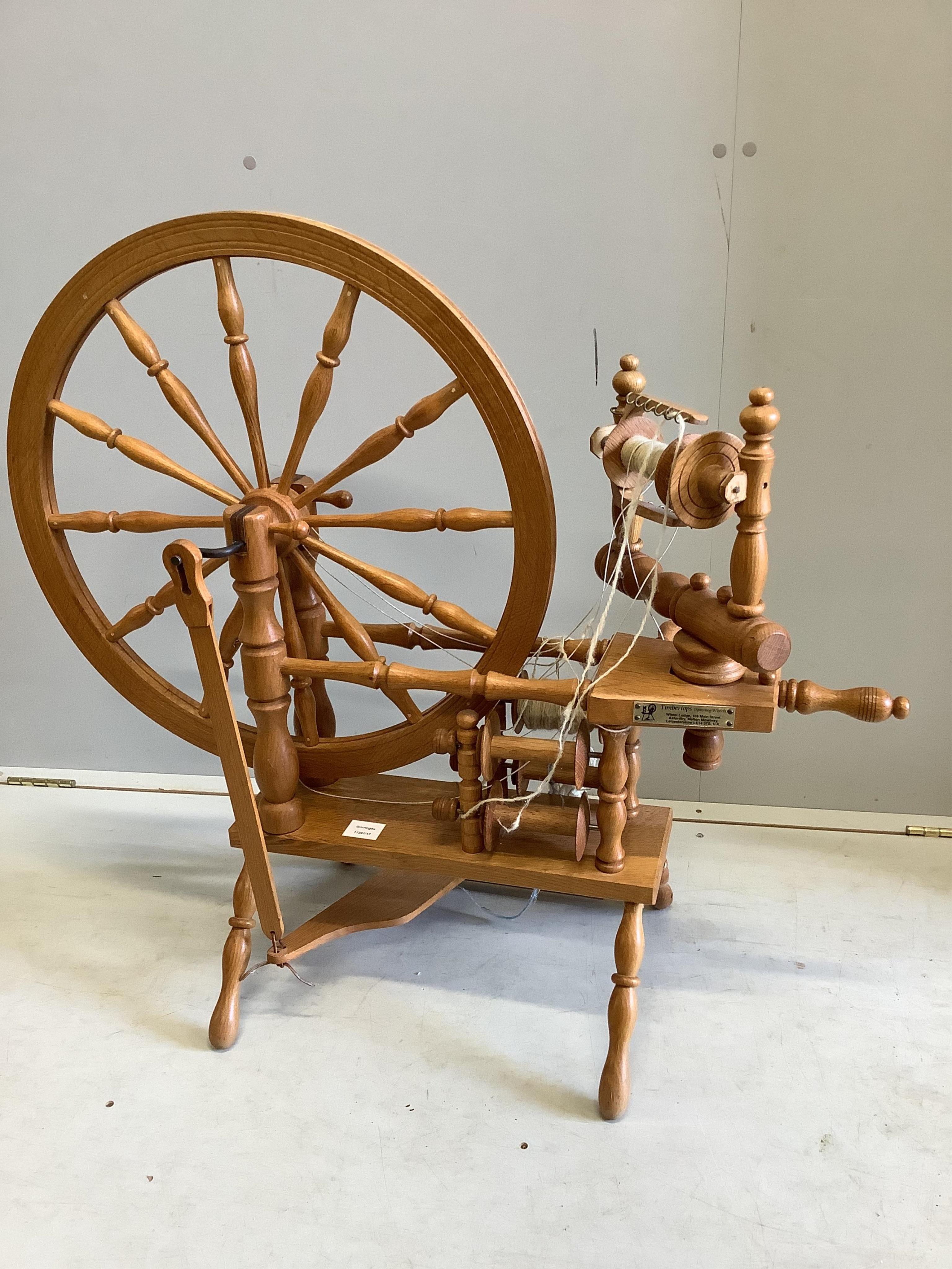 A Timbertops Leicester oak spinning wheel, height 86cm. Condition - good